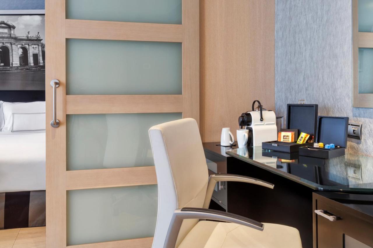 Melia Madrid Princesa Exterior photo A sliding door